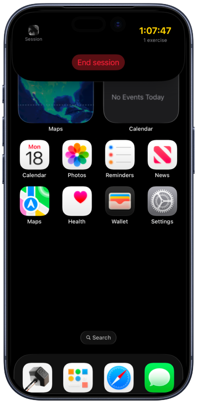 iPhone home screen with an expanded Dynamic Island active workout session